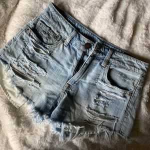 Distressed light denim shorts